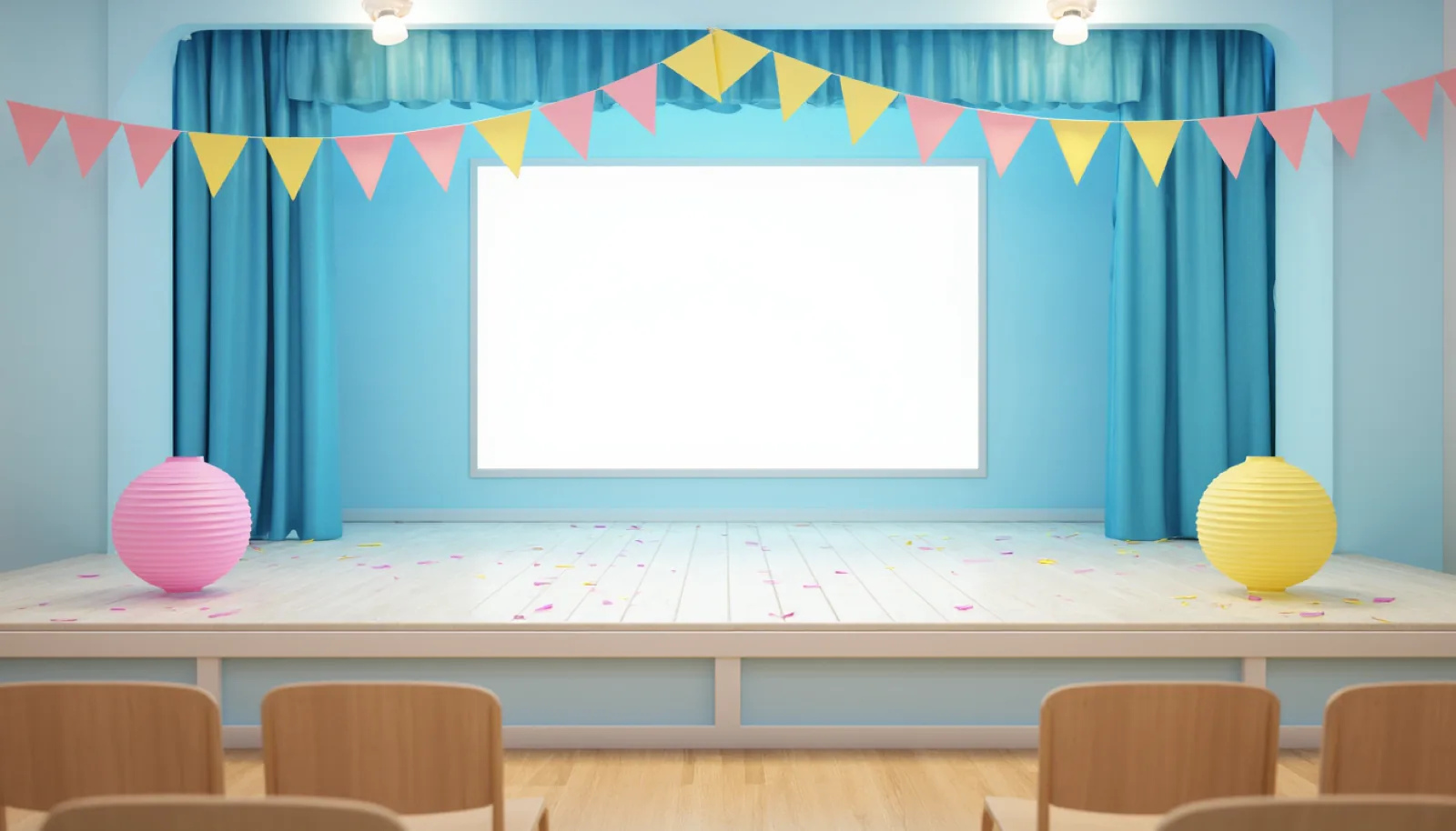 The community hall stage set up for a children's dance show, with paper garlands, warm lights and empty chairs